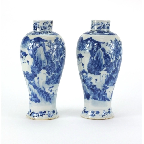 493 - Pair of Chinese blue and white baluster vases, both hand painted with figures and a river landscape,... 