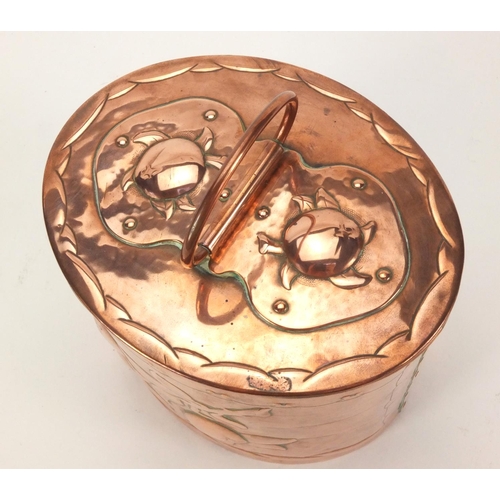 792 - Arts & Crafts Newlyn copper tea caddy of oval form with handle, embossed with fruit, 12.5cm high exc... 