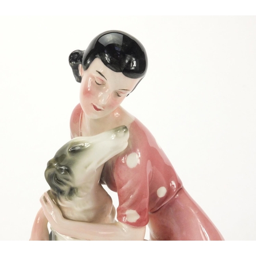 760 - Art Deco Katzhutte figure of a young female with her dog, factory marks to the base, 25cm high