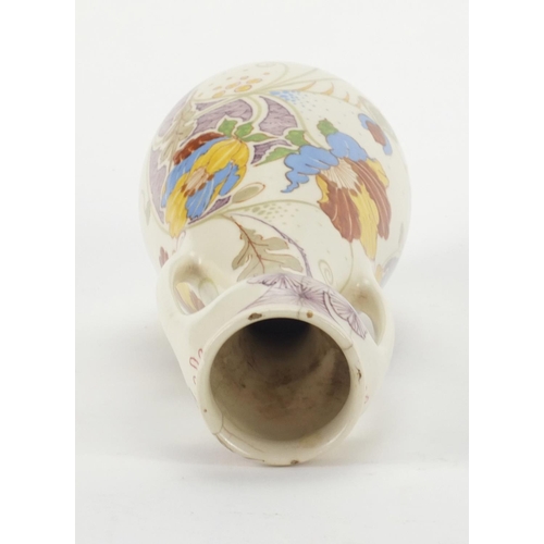 774 - Ivora Gouda vase with twin handles and pot and cover, both hand painted with stylised flowers, each ... 