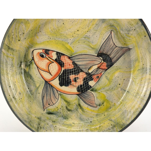 755 - Cornish studio pottery dish by Adrian Brough, hand painted with a stylised fish, initials and dated ... 