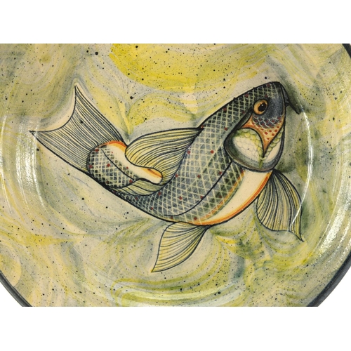 754 - Cornish studio pottery dish by Adrian Brough, hand painted with a stylised fish, initials and dated ... 