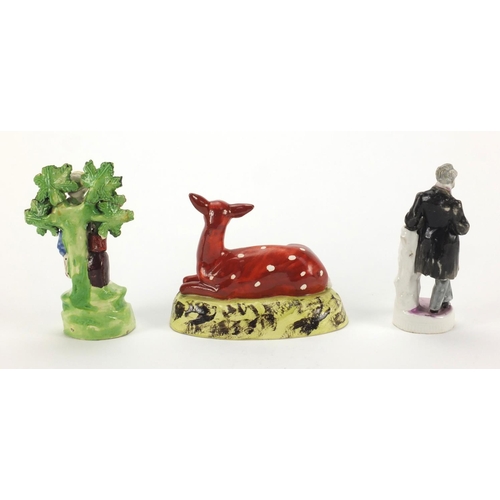 696 - Staffordshire pottery model of a deer together with a Staffordshire pearl ware model of the gardener... 