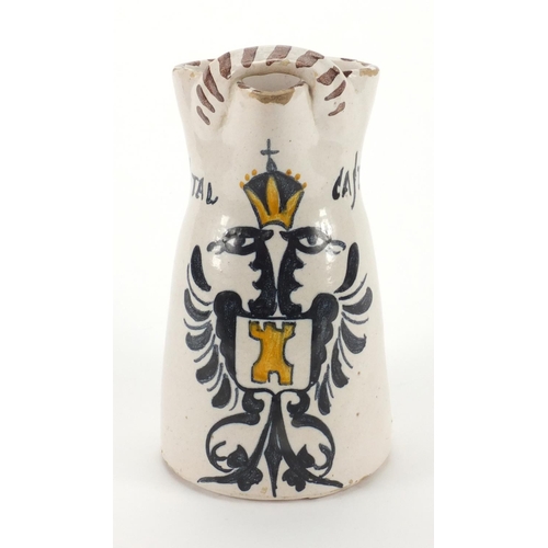 676 - Continental pottery jug hand painted with crest  and Hostal Castilla, 20cm high