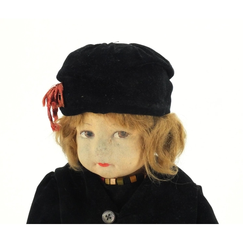 370 - 1930's Norah Wellings felt doll wearing and orange dress, black overcoat and hat, 53cm in length