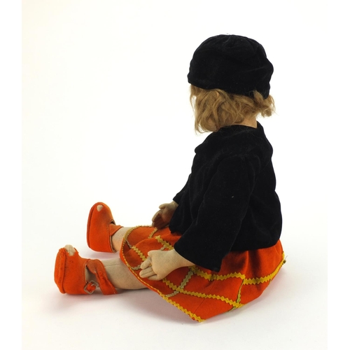 370 - 1930's Norah Wellings felt doll wearing and orange dress, black overcoat and hat, 53cm in length