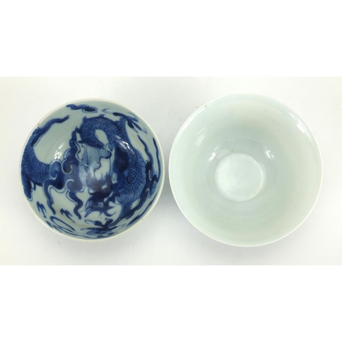 498 - Two Chinese blue and white porcelain bowls, one hand painted with flowers the other with dragons cha... 