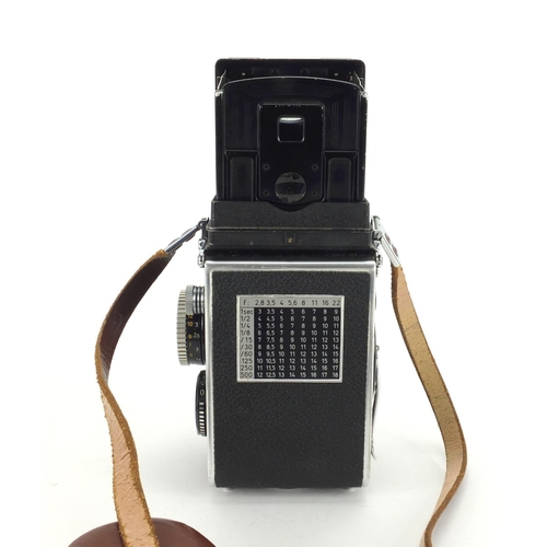 131 - Rolleiflex 35F camera model E with Schnider lense,  75mm Reolleiflex hood and synchro-compur shutter... 