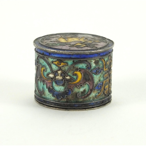 554 - Chinese cylindrical  silver box and cover, the cover enamelled with a mythical animal and bats, char... 