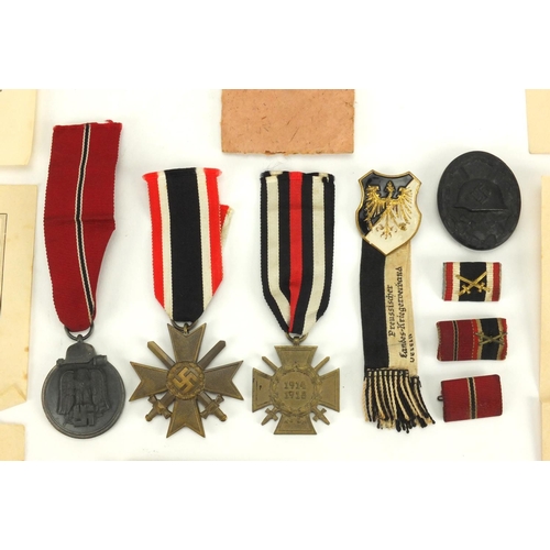 279 - German Military medals and badges relating to OBERGEFREITEN WERNER HAHLBOHM including wounds badge a... 