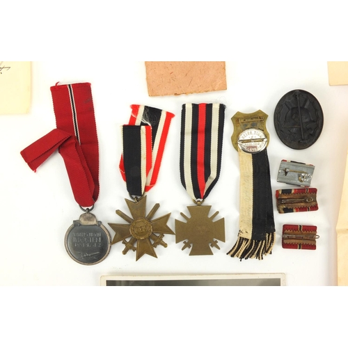 279 - German Military medals and badges relating to OBERGEFREITEN WERNER HAHLBOHM including wounds badge a... 