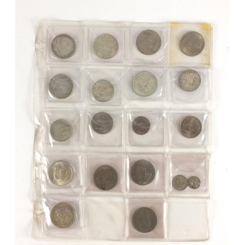 212 - Queen Anne and later predominantly British coinage, some silver housed in a folder including a 1711 ... 