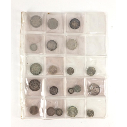 212 - Queen Anne and later predominantly British coinage, some silver housed in a folder including a 1711 ... 