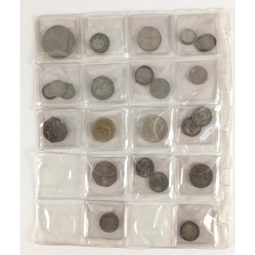 212 - Queen Anne and later predominantly British coinage, some silver housed in a folder including a 1711 ... 