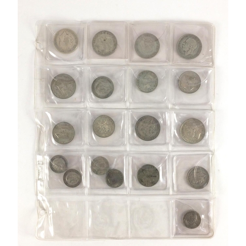 212 - Queen Anne and later predominantly British coinage, some silver housed in a folder including a 1711 ... 