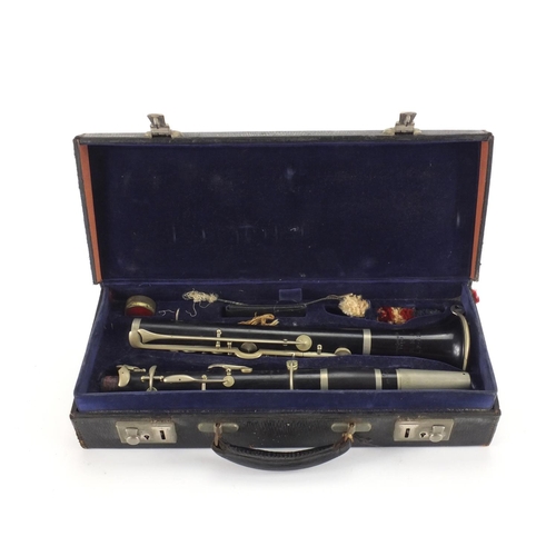 234 - Boosey and Hawkes four piece wooden clarinet with velvet lined fitted carrying case, each piece numb... 