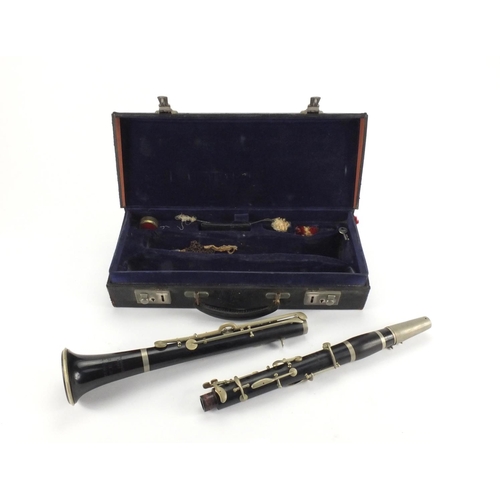 234 - Boosey and Hawkes four piece wooden clarinet with velvet lined fitted carrying case, each piece numb... 