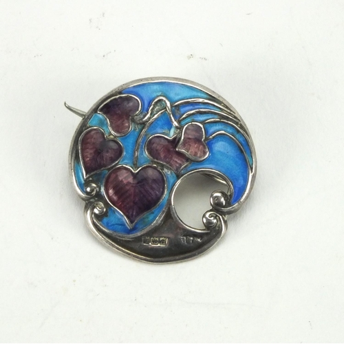 803 - Arts Nouveau silver and enamelled brooch, with stylised flowers, 2.8cm in diameter, approximate weig... 