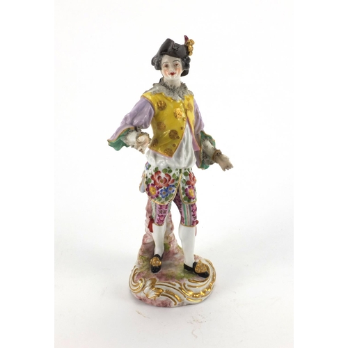 659 - Continental hand painted porcelain figure of a Dandy, blue cross sword marks to the base, 23cm high