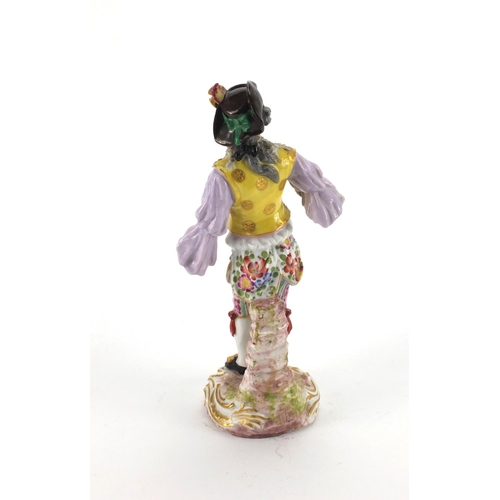 659 - Continental hand painted porcelain figure of a Dandy, blue cross sword marks to the base, 23cm high