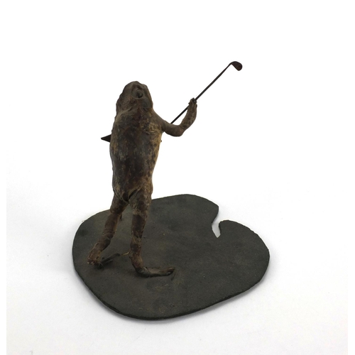 113 - Taxidermy interest toad in the form of a golfer, 20cm high