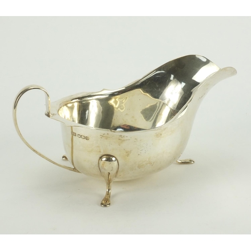 831 - Silver three footed sauce boat, E.V Sheffield 1936, 19cm long, approximate weight 203.0g