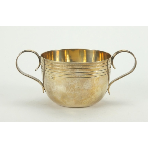 847 - Circular silver twin handle porringer, indistinct makers marks, London 1903, 8cm in diameter, approx... 