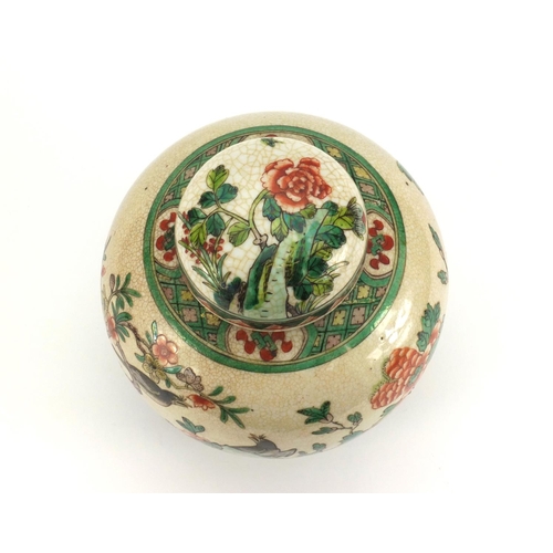 472 - Chinese porcelain ginger jar and cover, hand painted in the famille verte palette with birds of para... 