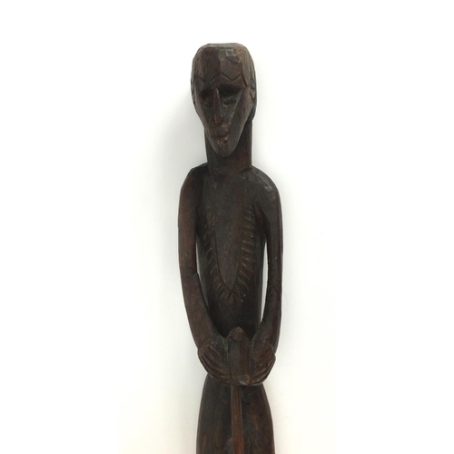 642 - Tribal interest wooden carving of a tribesman, 59cm high