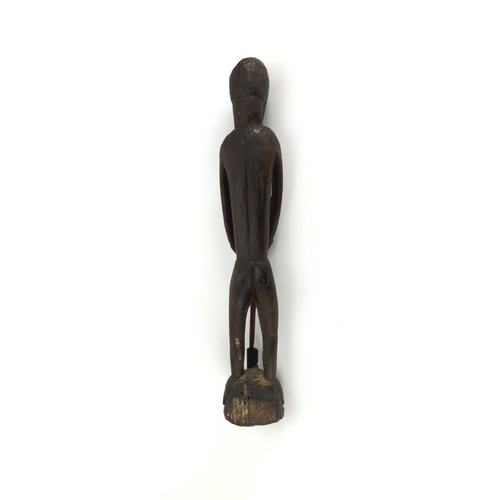 642 - Tribal interest wooden carving of a tribesman, 59cm high