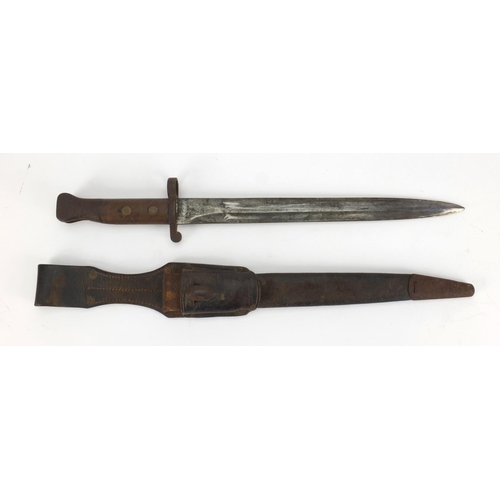 354 - Military interest bayonet with leather scabbard and frog, the bayonet with wooden grip and impressed... 