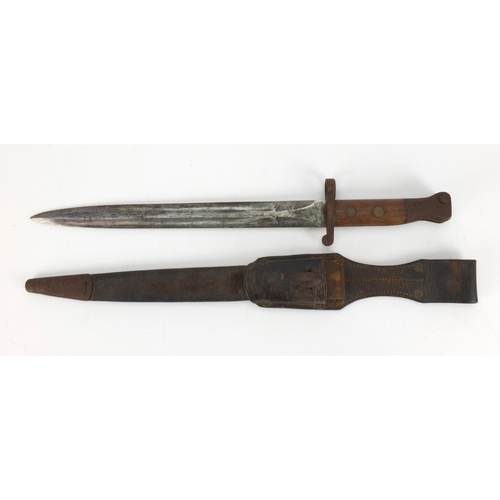 354 - Military interest bayonet with leather scabbard and frog, the bayonet with wooden grip and impressed... 