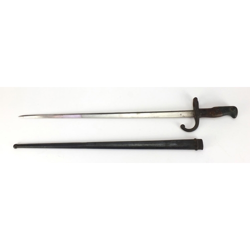 347 - 19th century French Military bayonet and scabbard with wooden grip, dated 1875 numbered 24559, engra... 