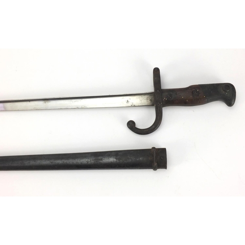 347 - 19th century French Military bayonet and scabbard with wooden grip, dated 1875 numbered 24559, engra... 