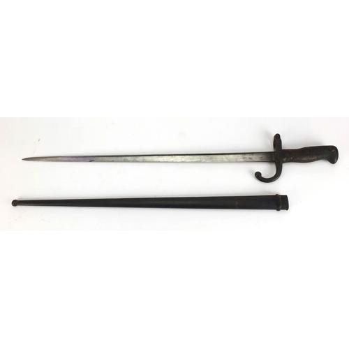 348 - 19th century French military interest St Etienne bayonet and scabbard with wooden grip, numbered 144... 