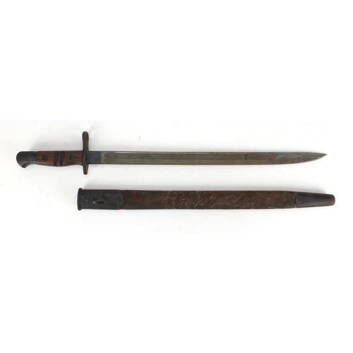 344 - British Military Remington 1913 pattern bayonet and scabbard with wooden grip, impressed marks to th... 