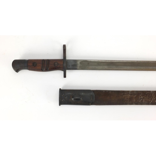 344 - British Military Remington 1913 pattern bayonet and scabbard with wooden grip, impressed marks to th... 