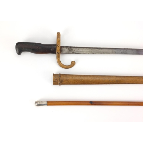 346 - 19th century French Military interest bayonet and scabbard with wooden grip, dated 1877, together wi... 