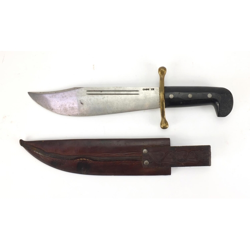 68 - American bowie knife with ebonised handle by Legitimus Collins & Co, with tooled leather sheath, the... 