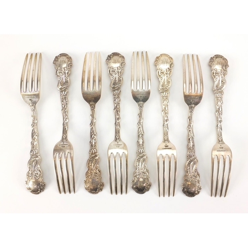 871 - Set of eight sterling silver forks, the terminals decorated with a figure in a wolf head dress and c... 