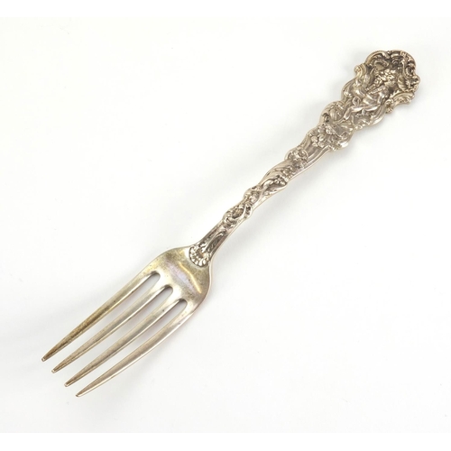 871 - Set of eight sterling silver forks, the terminals decorated with a figure in a wolf head dress and c... 