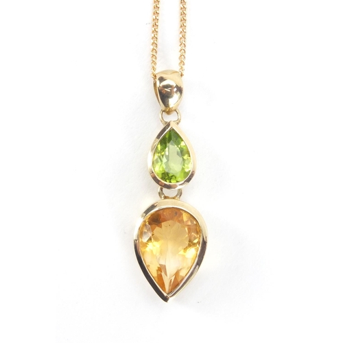 2604 - 9ct gold citrine and Peridot pendant on chain and matching ring, size N, approximate weight 7.4g