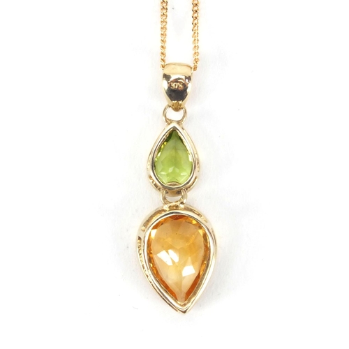 2604 - 9ct gold citrine and Peridot pendant on chain and matching ring, size N, approximate weight 7.4g