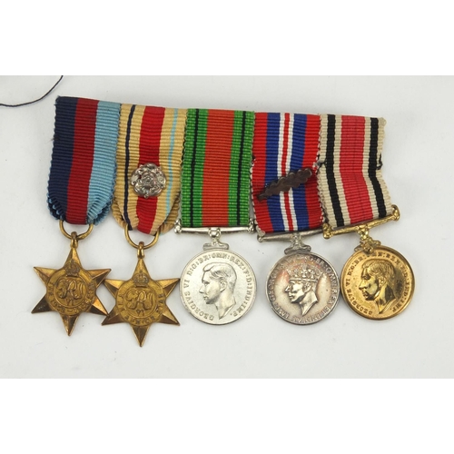 266 - World War II British Military medal group, including Faithful Service medal awarded to LESLIEM.APPS.... 