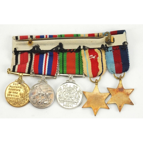 266 - World War II British Military medal group, including Faithful Service medal awarded to LESLIEM.APPS.... 