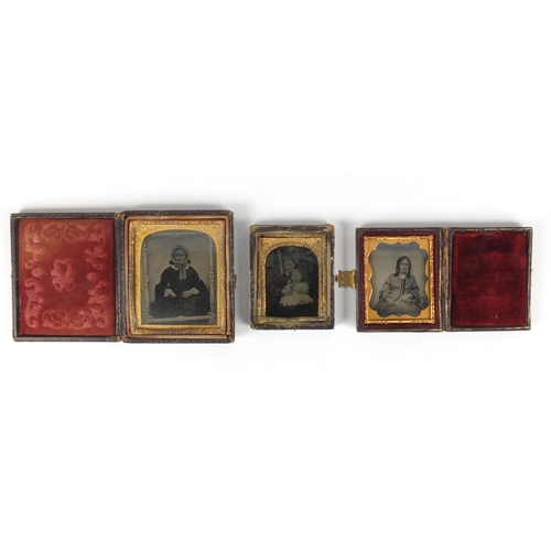 134 - Three Victorian black and white photographs each with gilt metal mounts, two housed in tooled leathe... 