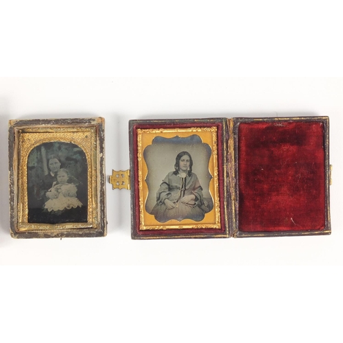 134 - Three Victorian black and white photographs each with gilt metal mounts, two housed in tooled leathe... 