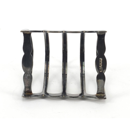 860 - Silver four slice toast rack, HA Sheffield 1932, 9.5cm high, approximate weight 106.5g