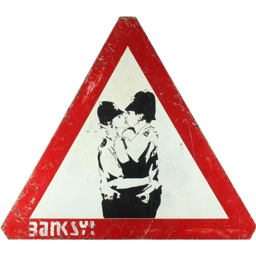 1246 - After Banksy - Oil onto triangular board, embracing policemen, 71cm x 83cm