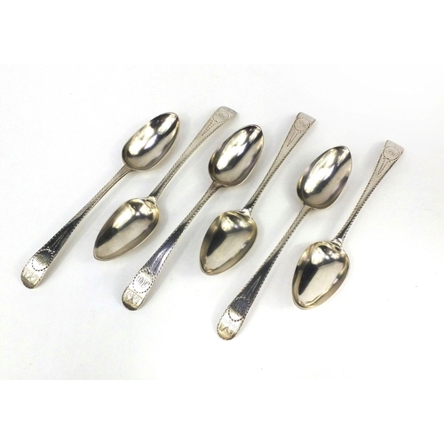 874 - Set of six Irish silver table spoons with engraved decoration, dated 1783,  each 22cm in length, app... 